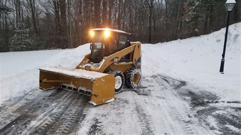 plowing snow with a track skid steer|industrial snow plow skid steer.